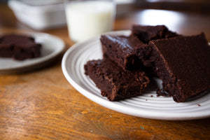A plate of sliced fudgy champurrado-style masa brownies 