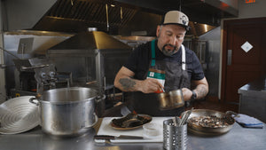 Chef Gustavo Romero cooking